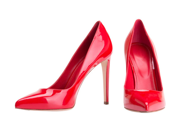 Red female shoes on a white background - Fotó, kép