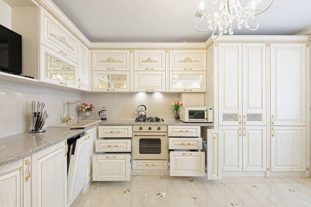 Luxury modern beige and cream colored kitchen interior - Foto, Imagen