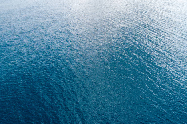 Aerial view of sea surface with splashing wave - Foto, imagen