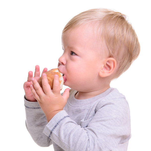 vauva syö leipää
 - Valokuva, kuva