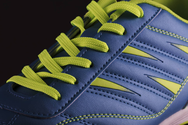 Texture of a blue sneaker closeup. Part of leather sports shoes - 写真・画像