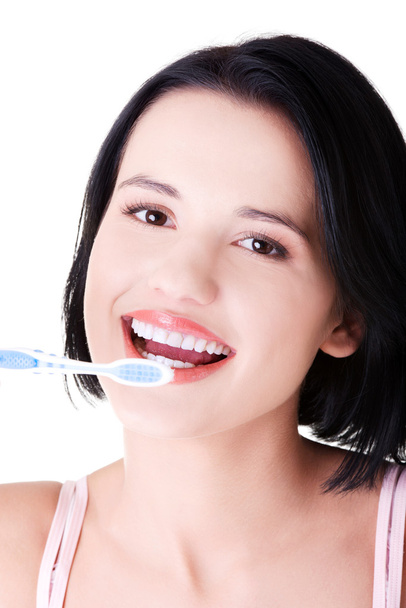 Woman with great teeth holding tooth-brush - Фото, изображение