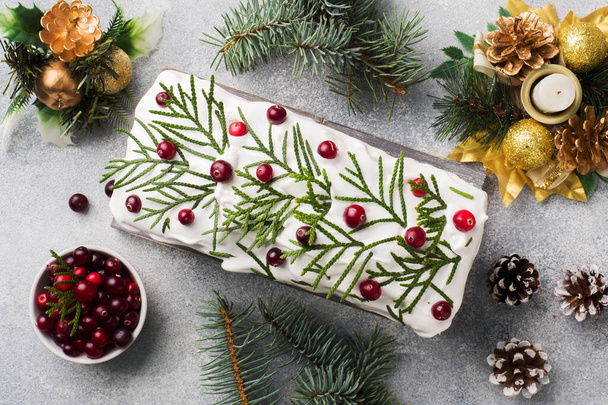 Traditional Christmas cake with cranberries on gray table background. Horizontal. Copy space. - Photo, Image