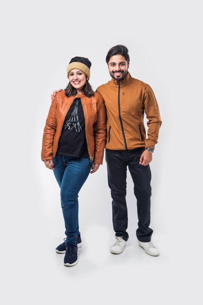 Indian couple in winter wear /warm clothes against white background - Photo, Image