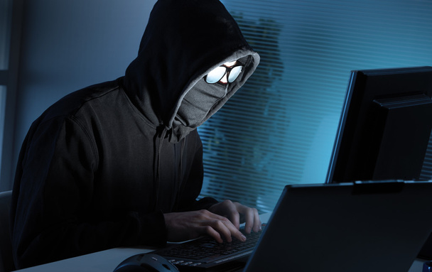 Hacker stealing data from computer - Foto, Imagen