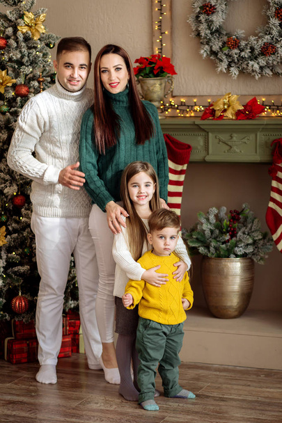 Mom, dad and children on New Year`s holidays. Family concept - Valokuva, kuva