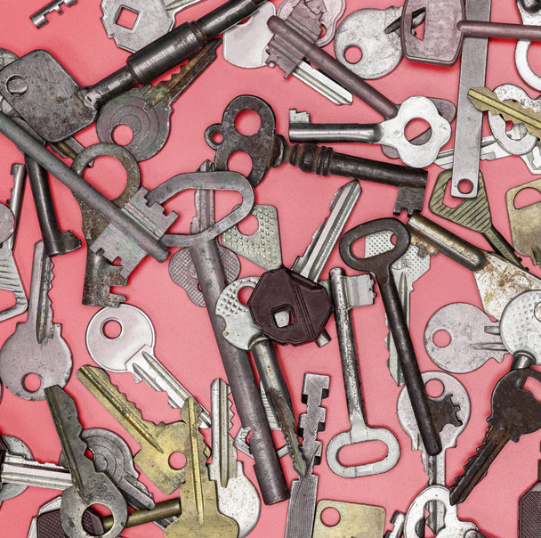 Keys set on pink background. Door lock keys and safes for proper - Photo, Image