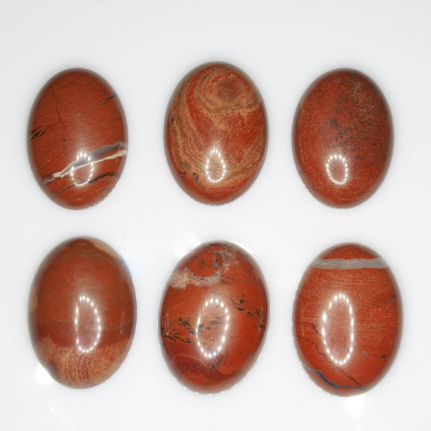 Natural red polished jasper on the white background - Photo, Image