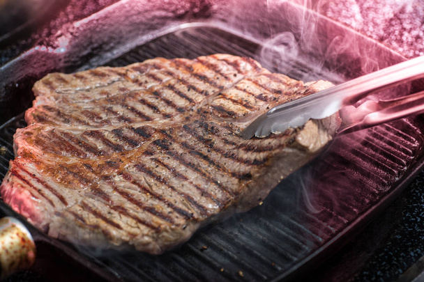 Sirloin steak grilled on grill pan - Фото, изображение