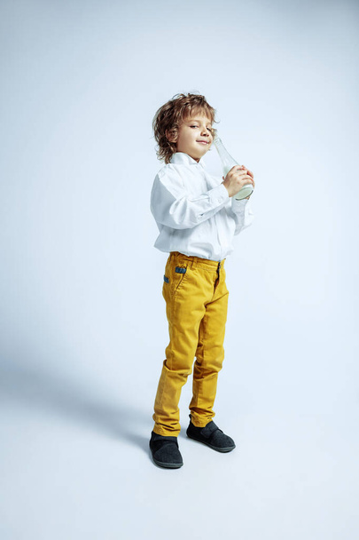 Pretty young boy in casual clothes on white studio background - Foto, immagini