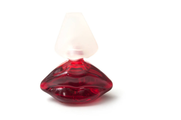 Salvator Dali perfume in red bottle in shaped mouth on white background - Foto, Imagem