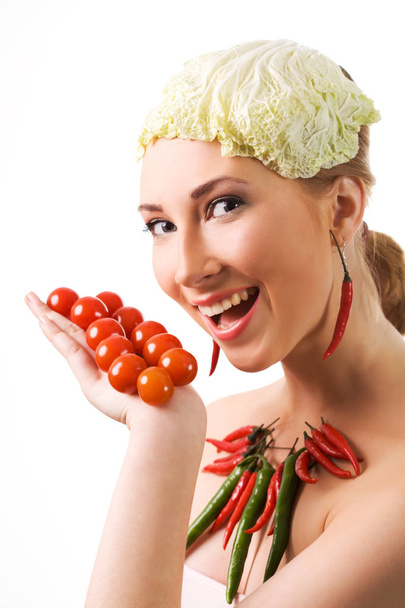 Portrait of cheerful girl with organic vegetables - Photo, Image