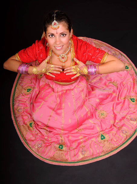 Top view of woman sitting in indian costume - 写真・画像