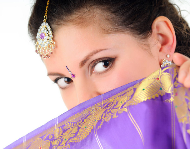 Woman covers face of purple veil - Foto, immagini