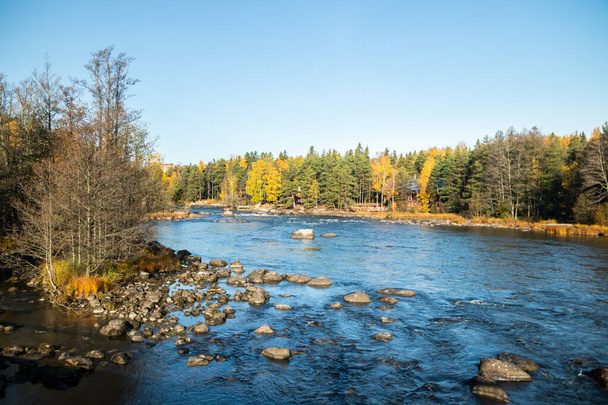 Beautiful autumn landscape on river Kymijoki near the Emperor Alexander lll fishing lodge Langinkoski. Kotka, Finland - Photo, Image
