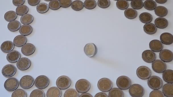 Two planes with a frame made with two euro coins and a coin circling in the center - Footage, Video