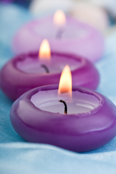Purple toned candles on baby silk (1) - Photo, Image