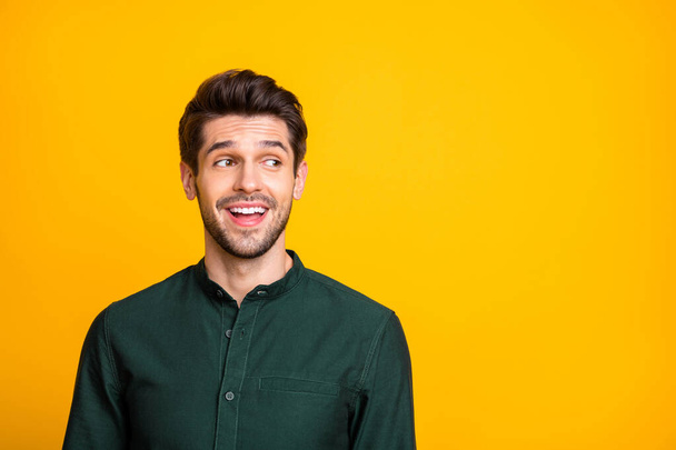 Portrait of funny funky guy look copyspace feel excited listen wonderful news information from his friends wear fashionable clothing isolated over yellow color background - Foto, imagen