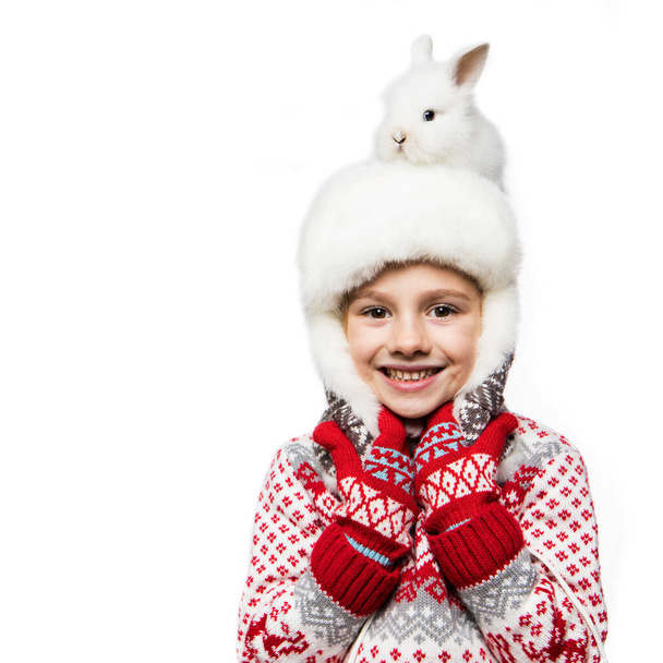 Small child with bunny. Merry Christmas and happy new year. - Фото, зображення