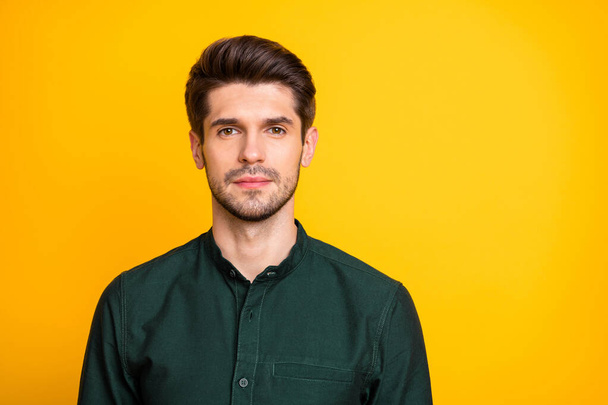 Portrait of serious focused man freelancer look ready solve job problems in his company wear casual style clothing isolated over yellow color background - Foto, Bild
