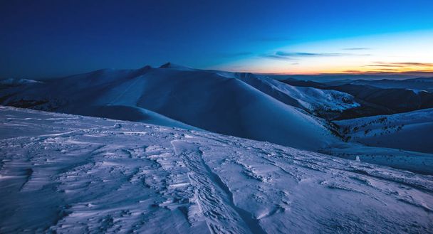 View of a steep ski slope with comfortable tracks - Fotó, kép