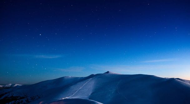 Empty ski resort under the moonlight at night - 写真・画像