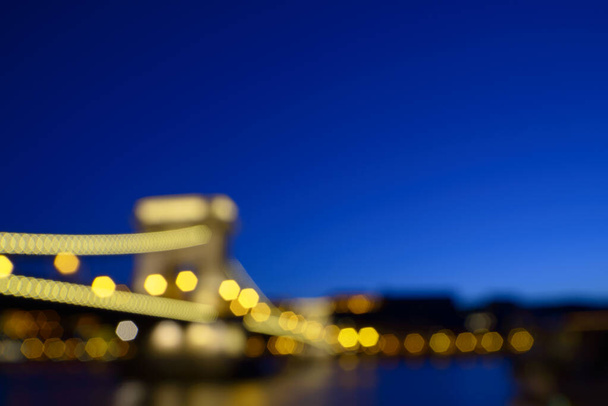 Romantic travel background with blurred Chain Bridge in Budapest - Fotó, kép