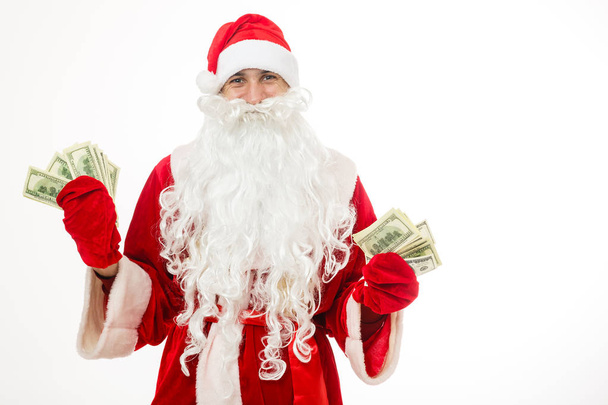Santa Claus holding money isolated on white background - Foto, afbeelding