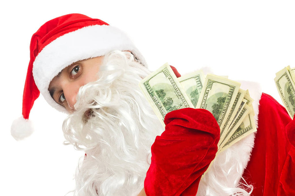 Santa Claus holding money isolated on white background - Foto, afbeelding