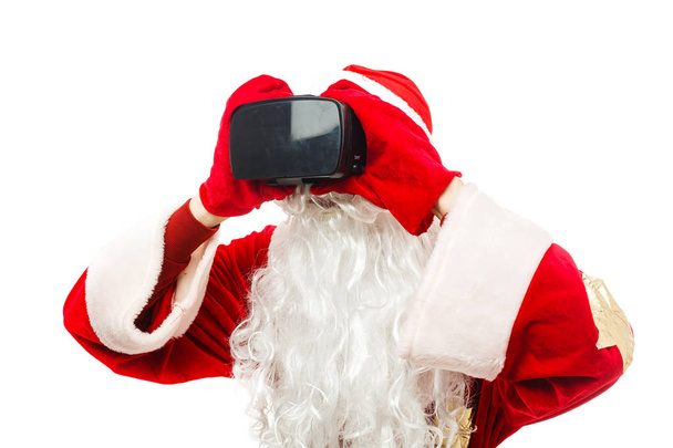 De kerstman draagt een virtual reality bril  - Foto, afbeelding