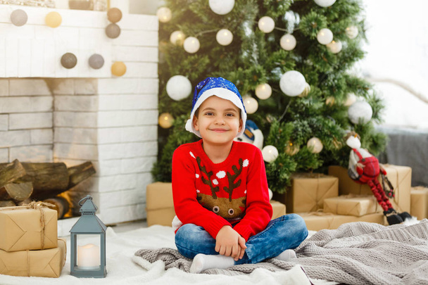 little boy near the Christmas tree - Photo, Image