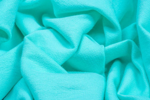  Textura, fundo, padrão. O tecido é de malha azul, turqu
 - Foto, Imagem