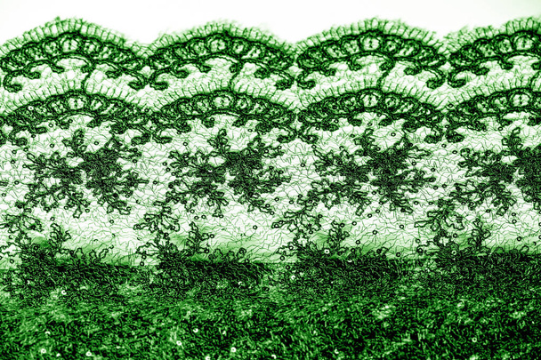 Textuur, patroon, Lace stof in het groen op een witte achtergrond. Th - Foto, afbeelding