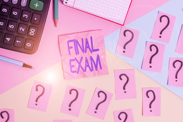 Handwriting text Final Exam. Concept meaning test given to student at the end of a course of study or training Mathematics stuff and writing equipment above pastel colours background. - Photo, Image