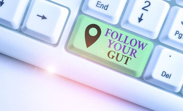 Writing note showing Follow Your Gut. Business photo showcasing Listen to intuition feelings emotions conscious perception. - Photo, Image