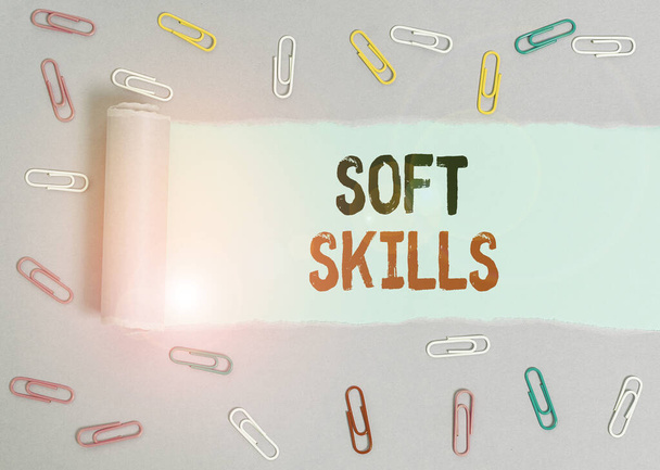 Conceptual hand writing showing Soft Skills. Business photo showcasing demonstratingal attribute that supports situational awareness Paper clip and torn cardboard on wood classic table backdrop. - Photo, Image