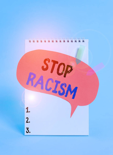 Text sign showing Stop Racism. Conceptual photo end the antagonism directed against someone of a different race Spiral notepad speech bubble arrow banners lying cool pastel background. - Foto, immagini