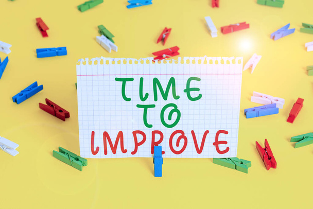 Handwriting text Time To Improve. Concept meaning telling someone to develop himself Study hard Courses Colored clothespin papers empty reminder yellow floor background office. - Photo, Image