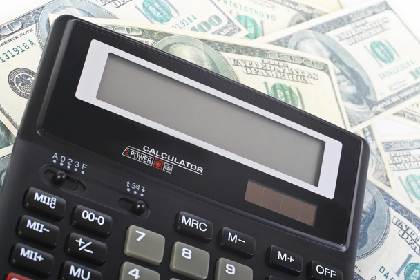 calculator on banknotes - 写真・画像