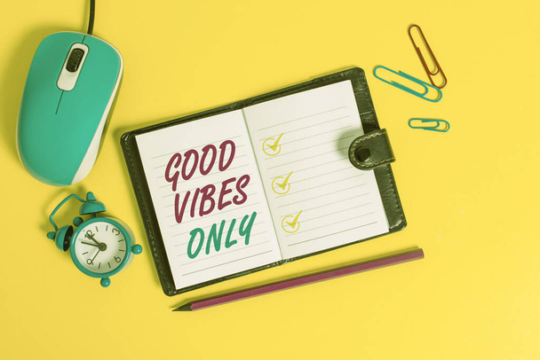 Word writing text Good Vibes Only. Business concept for Just positive emotions feelings No negative energies Locked diary sheets clips marker mouse alarm clock colored background. - Foto, Imagem