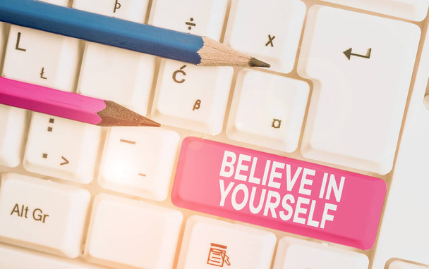 Text sign showing Believe In Yourself. Conceptual photo Encouraging someone Selfconfidence Motivation quote White pc keyboard with empty note paper above white background key copy space. - Photo, Image