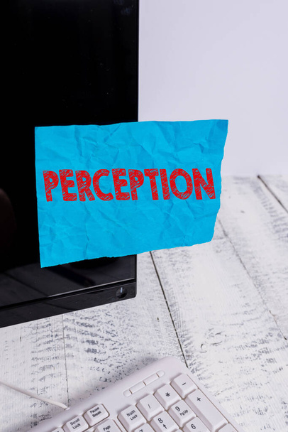 Handwriting text Perception. Concept meaning individuals organize and interpret their sensory impressions Notation paper taped to black computer monitor screen near white keyboard. - 写真・画像