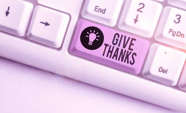 Text sign showing Give Thanks. Conceptual photo express gratitude or show appreciation Acknowledge the kindness White pc keyboard with empty note paper above white background key copy space. - Photo, Image