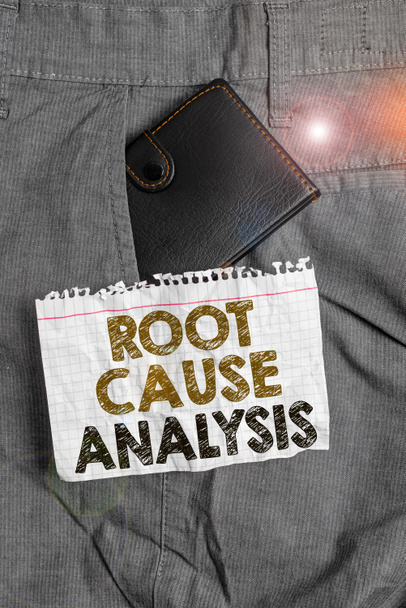 Writing note showing Root Cause Analysis. Business photo showcasing Method of Problem Solving Identify Fault or Problem Small wallet inside trouser front pocket near notation paper. - Photo, Image