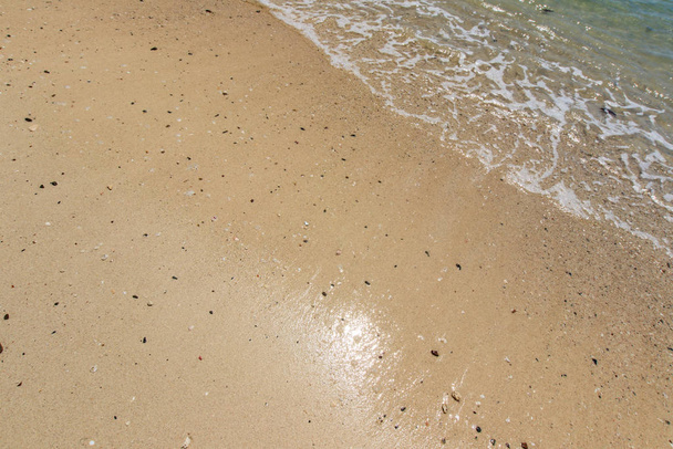 Sea surf on the beach with sand. - Photo, Image