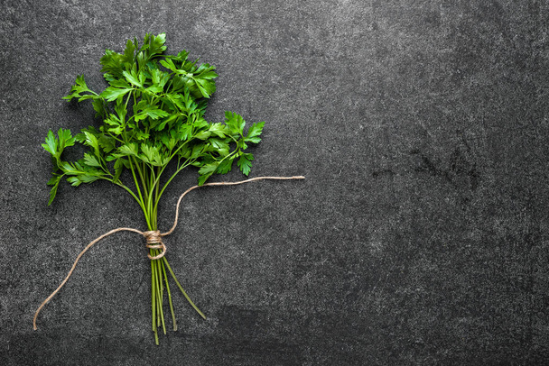 Fresh parsley, green herb on dark background - Photo, Image