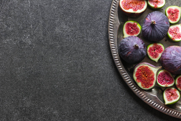 Fresh figs slices. Purple fig, top view. - Fotó, kép
