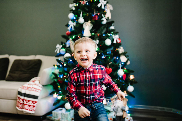 Happy boy play at interior home. Merry Christmas and Happy New year. - Valokuva, kuva