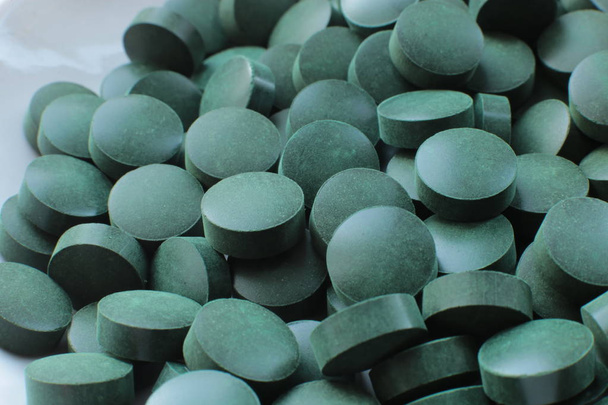 macro background pills, medical bio supplements and vitamins - 写真・画像