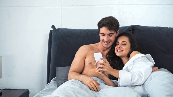 girlfriend taking selfie with boyfriend and showing peace  - Footage, Video